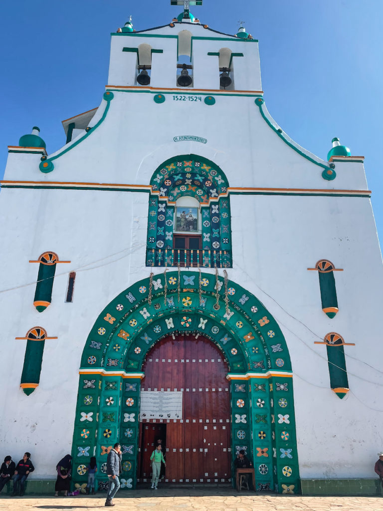 Green and white exterior of Chamula Church. 